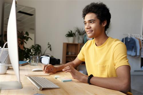 Teen boy on computer 